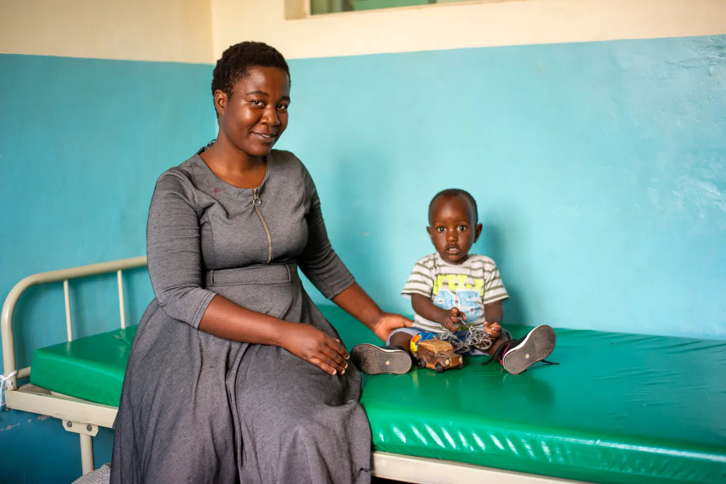 Miriam Milazi keeps an eye on her son Elvin as he plays with a toy at Mangochi Maternity Wing, where he was part of the Milestones Study supported by UNICEF.