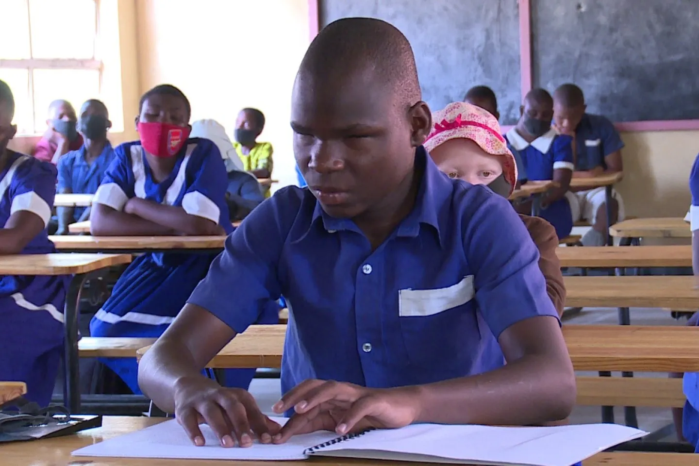 Winston a Standard 4 Learner Reads Braille in Class