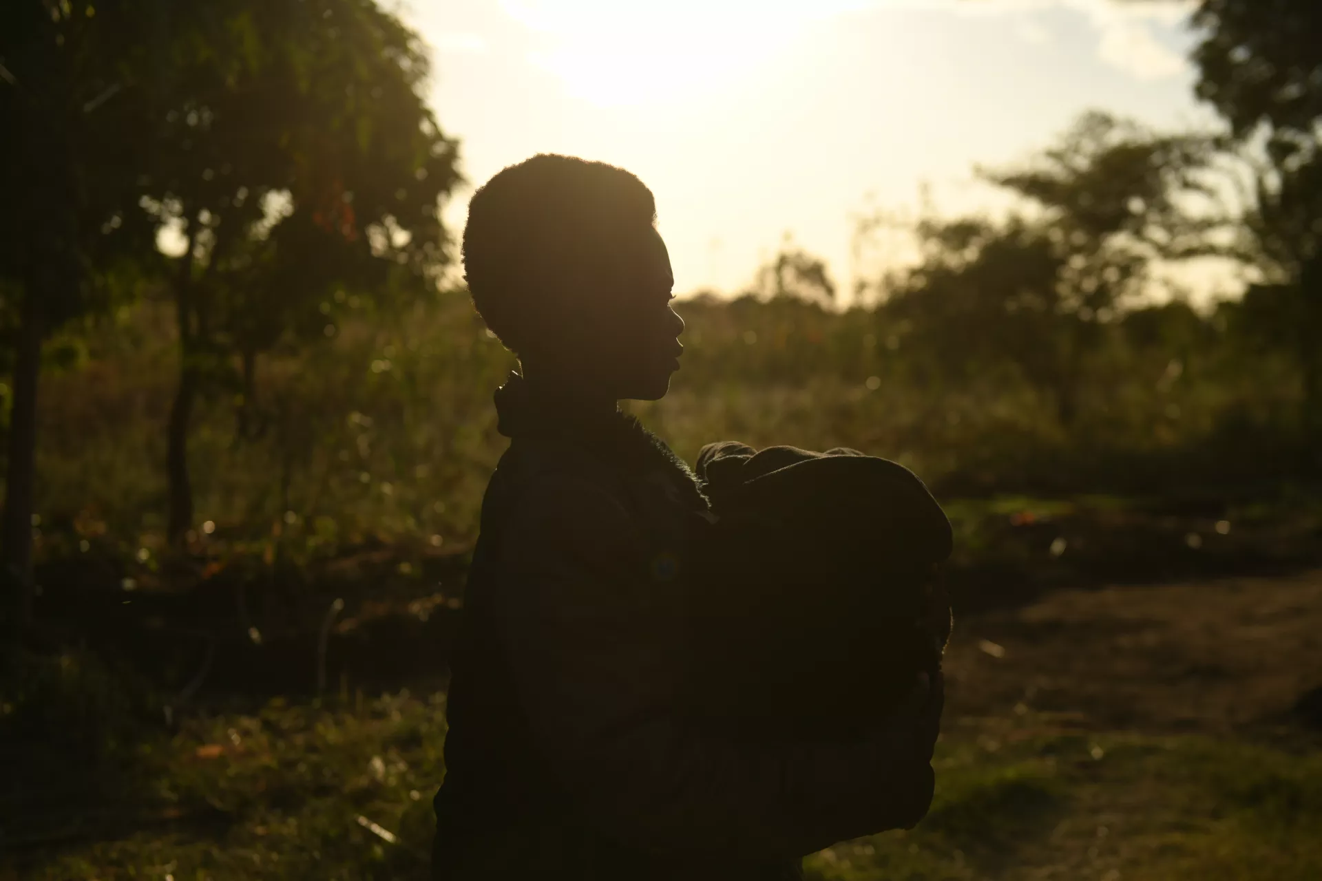 Chimwemwe holding her one-month-old baby 