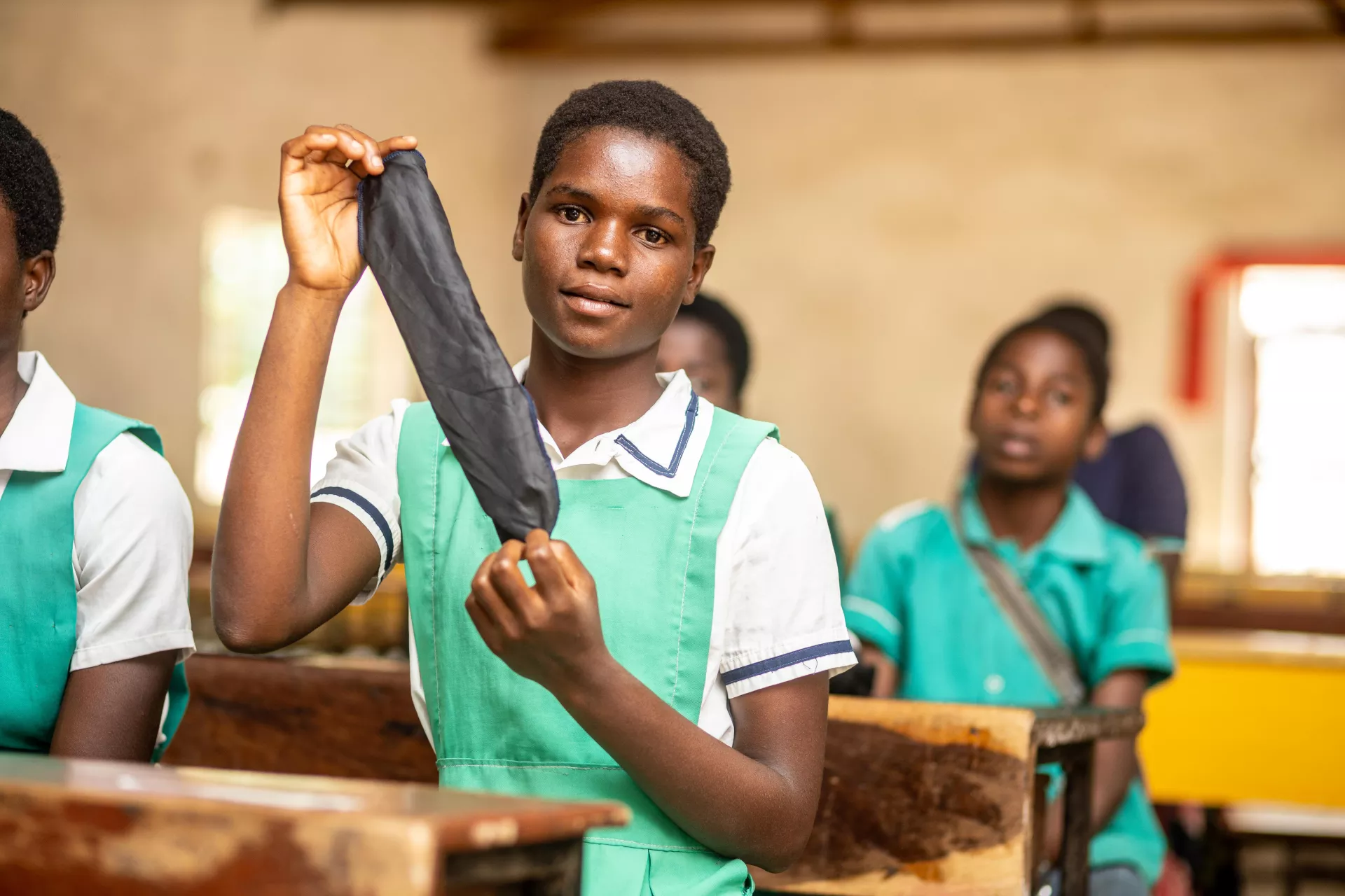 Bridget Banda showing her resuable sanitary pad