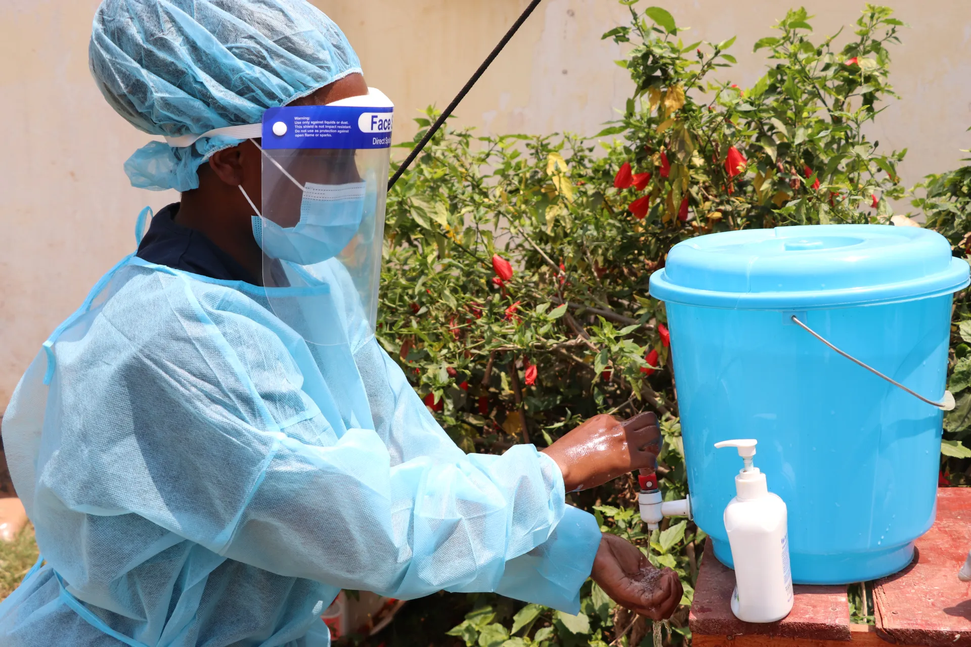 A health worker washes her hands at Mchinji Emergency Treatment Unit