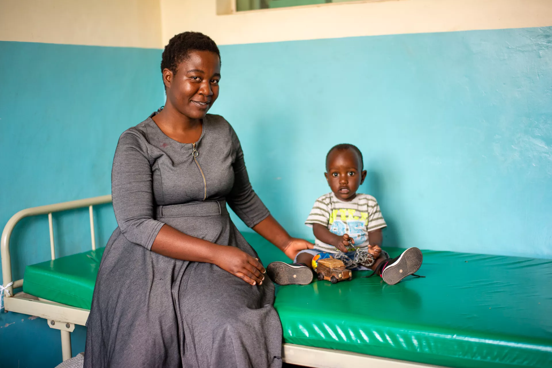 Miriam Milazi keeps an eye on her son Elvin as he plays with a toy at Mangochi Maternity Wing, where he was part of the Milestones Study supported by UNICEF.