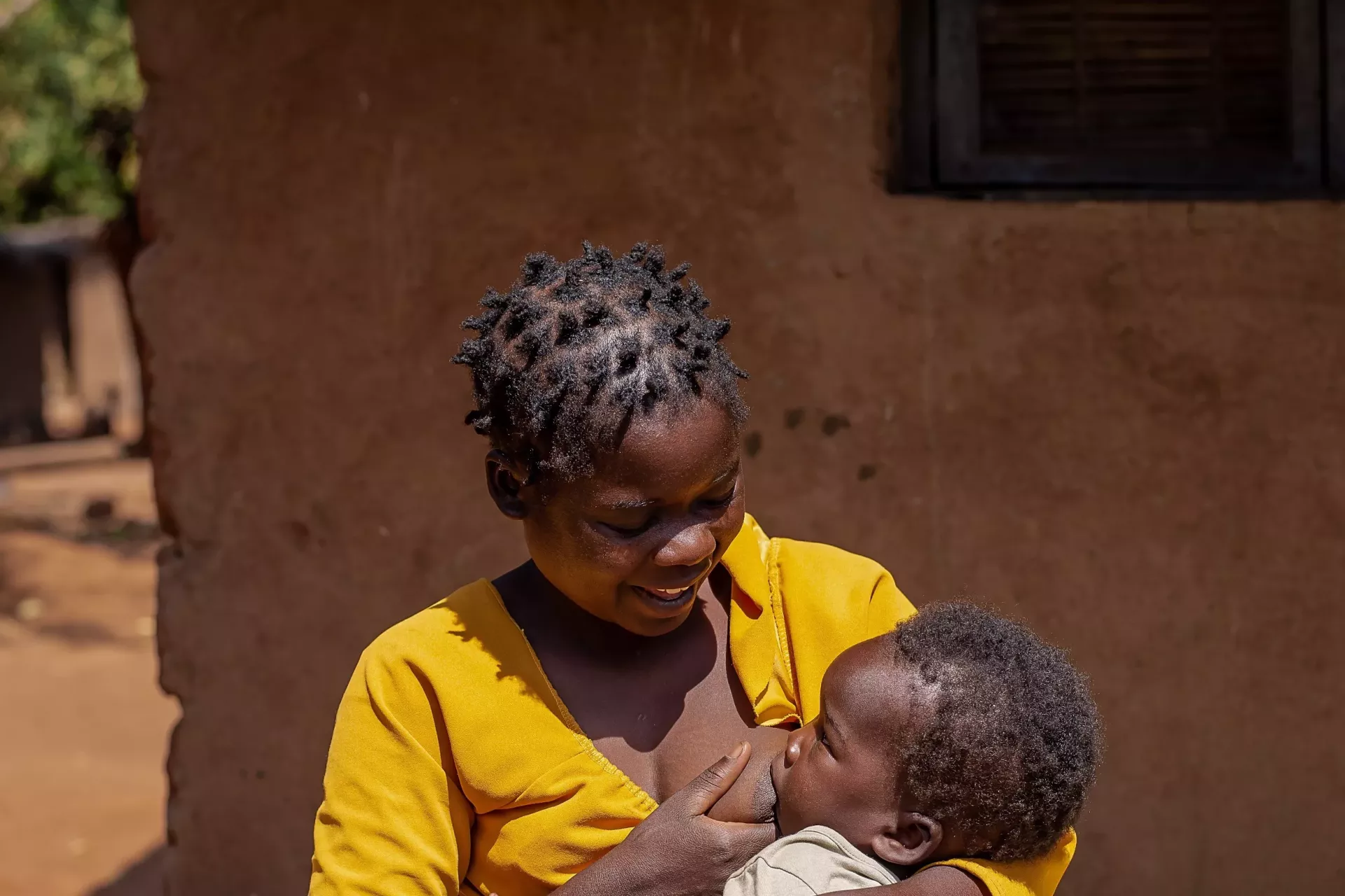 A mother is breastfeeding her child 
