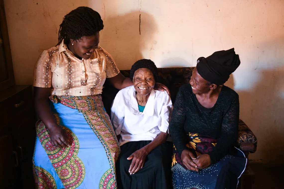 95-year-old Evelyn Malinda is seen with her daughter Elisa Maulidi (right) and granddaughter Jean Musicha (Left) at her home in Muloza, Mulanje, southern Malawi on 22 July 2022