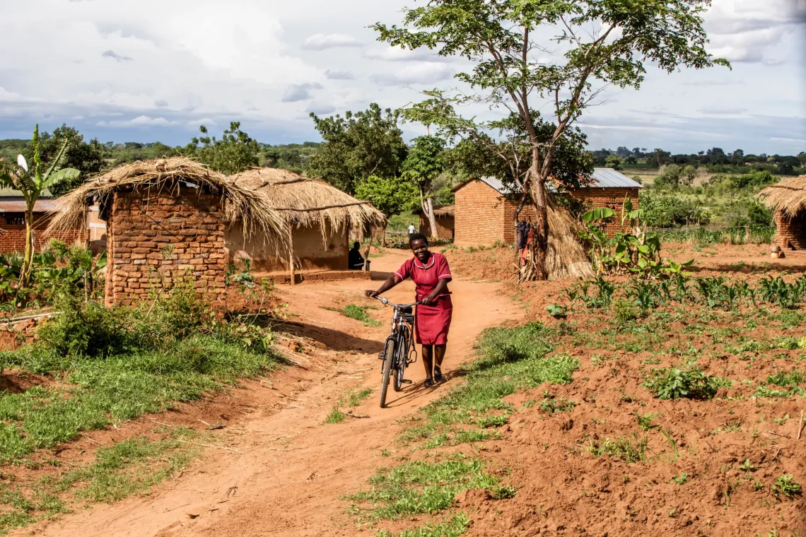 Lungu, with the bike during monitoring in Matula Village