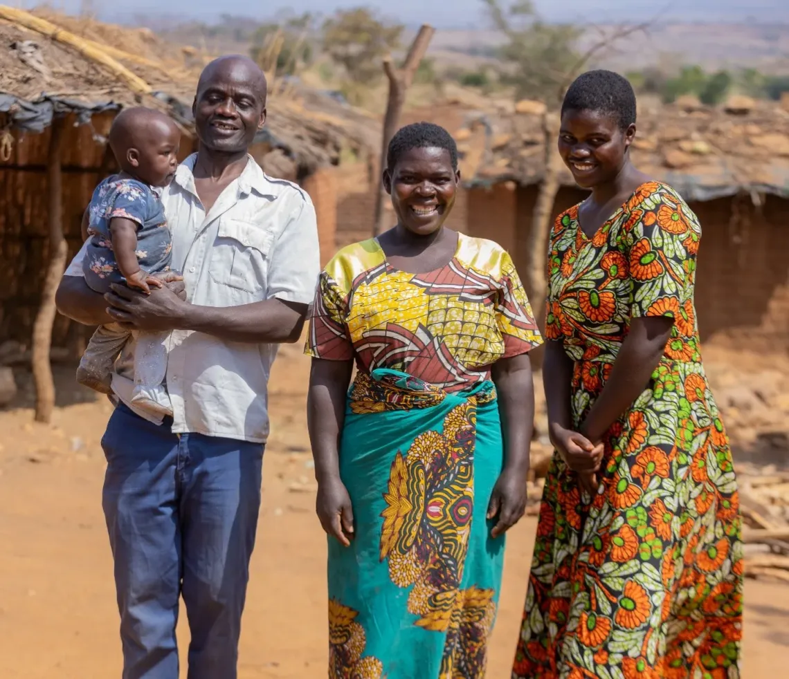 Mwayiwawo with her parents and child.