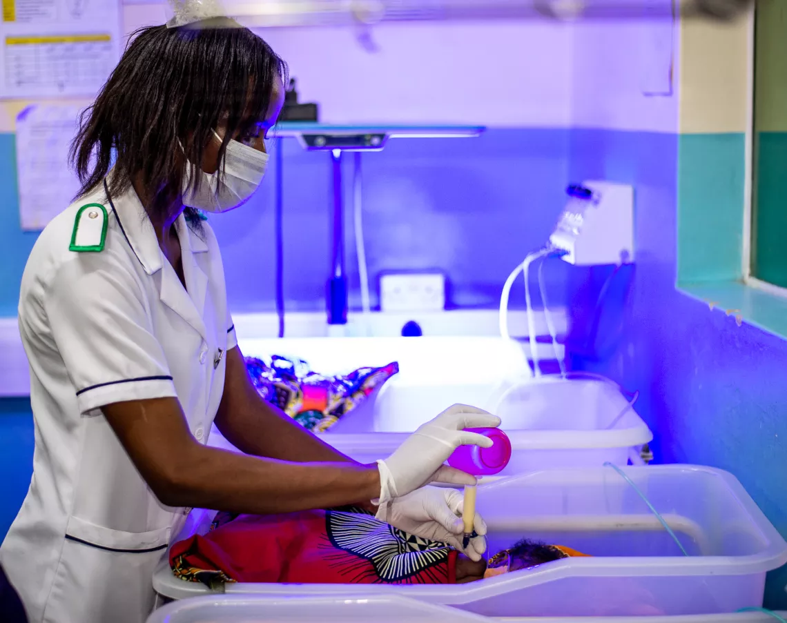 Nurse Ruth Phiri cares for a newborn in the nursery section at Mangochi Maternity Wing, where UNICEF is supporting the Milestones Study to improve sick newborn care.
