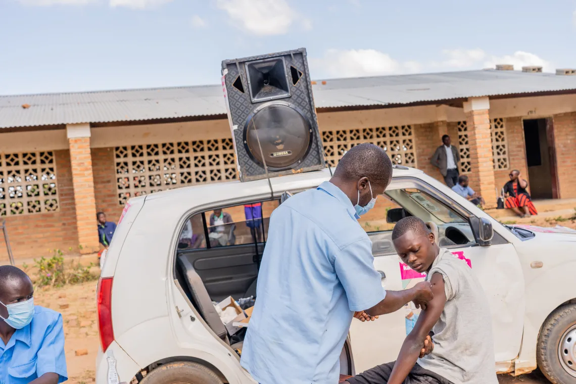 Robert vaccinating one of the learners 