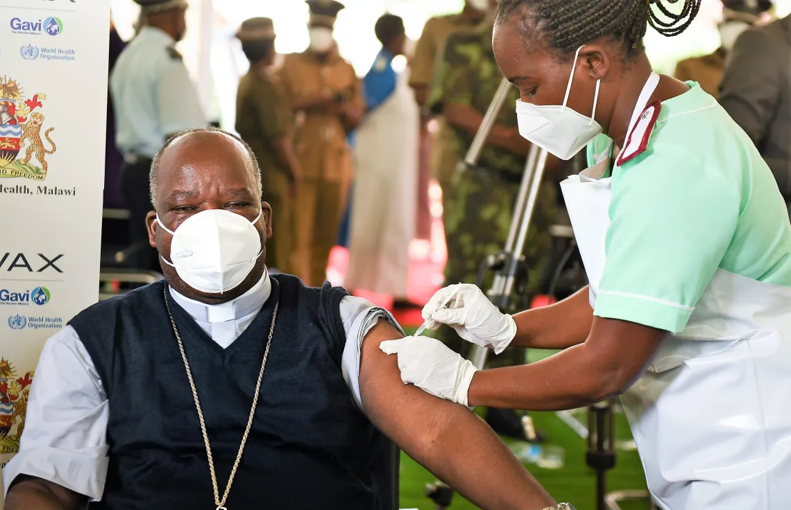 Archbishop Msusa getting vaccinated at Zomba Field Hospital