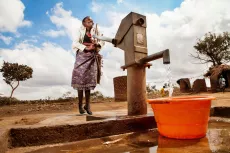Kosalata Banda collects water from a recently installed borehole in the village of Chikosa, Dowa District