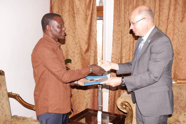Rudolf Schwenk presenting his papers to the Minister of Foreign Affairs, Hon. Kasaila