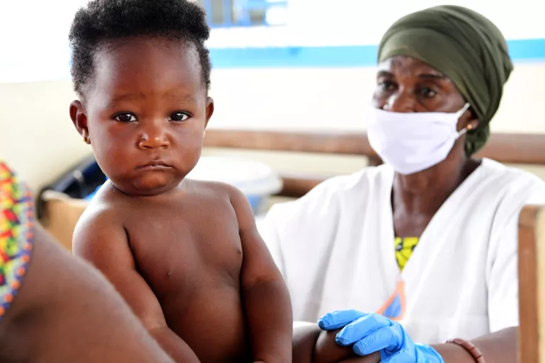 Child undergoing immunization during COVID-19