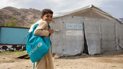 Kunar Province, Afghanistan, 2025. After an earthquake forced his family from their home,  nine-year-old Abdullah was unable to continue school and felt deeply discouraged. Today, he is smiling again as he returns to learning at a temporary classroom supported by UNICEF and partners