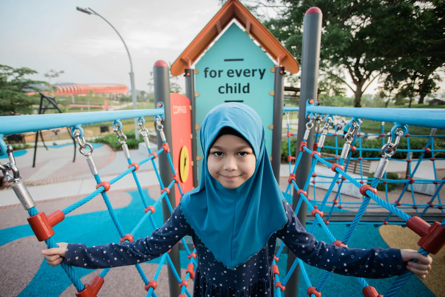 Child on a playground bridge