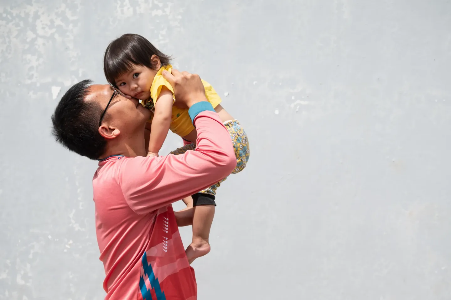 Father holding up his child