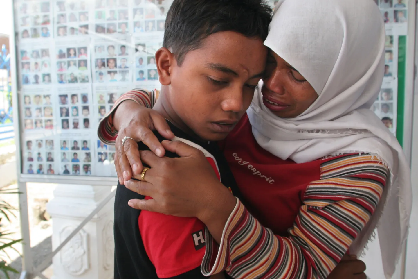 boy hugging mother
