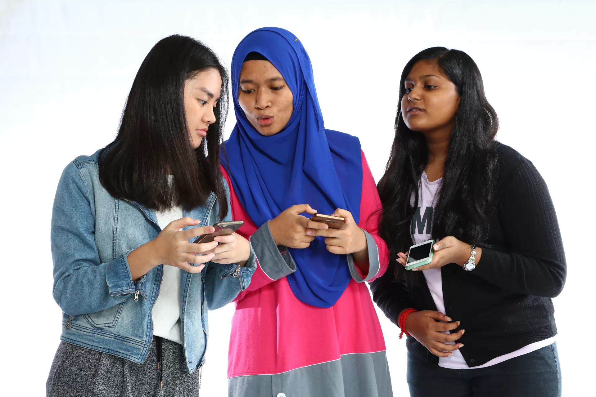 Three girls on their phone