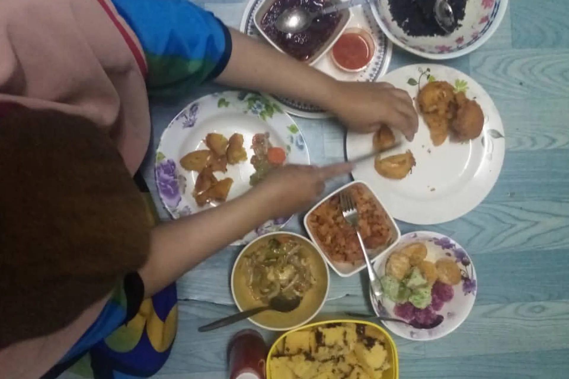Lady cuts food into small portions