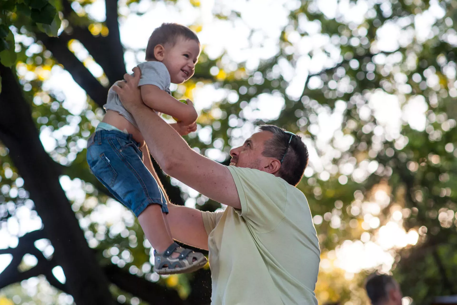 Father holding up his child in the air