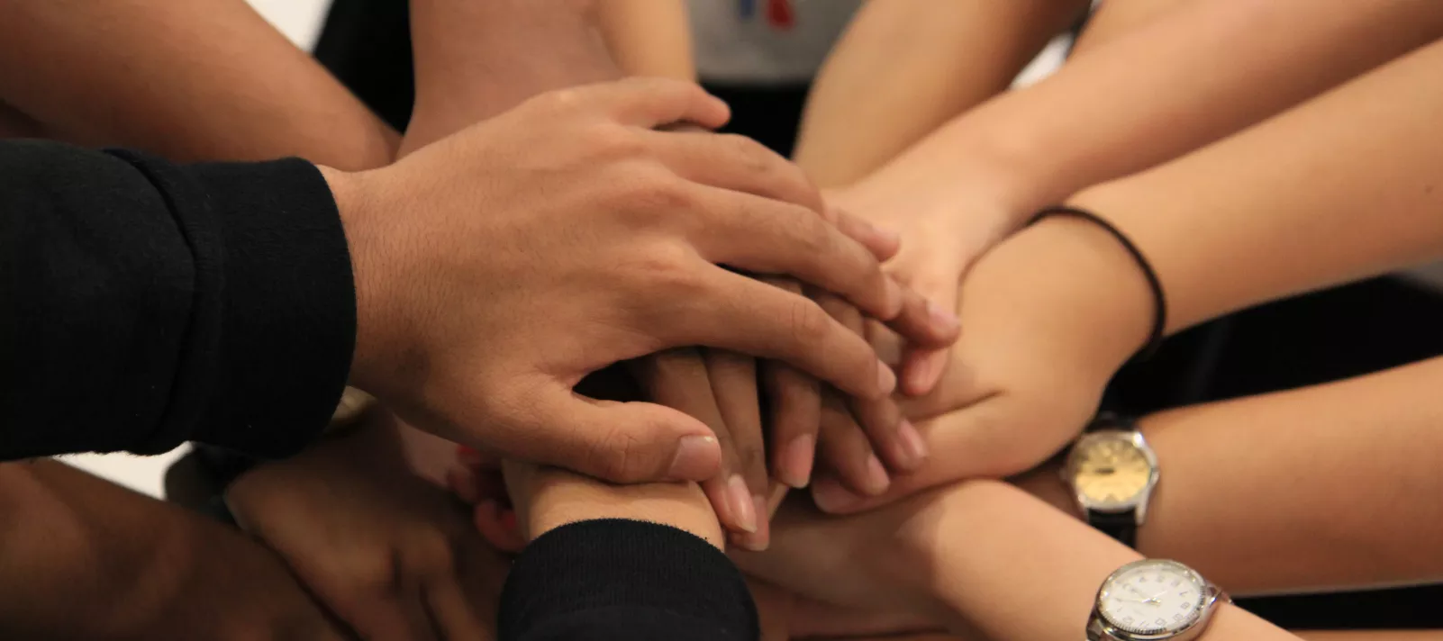Teens link hands in collaboration