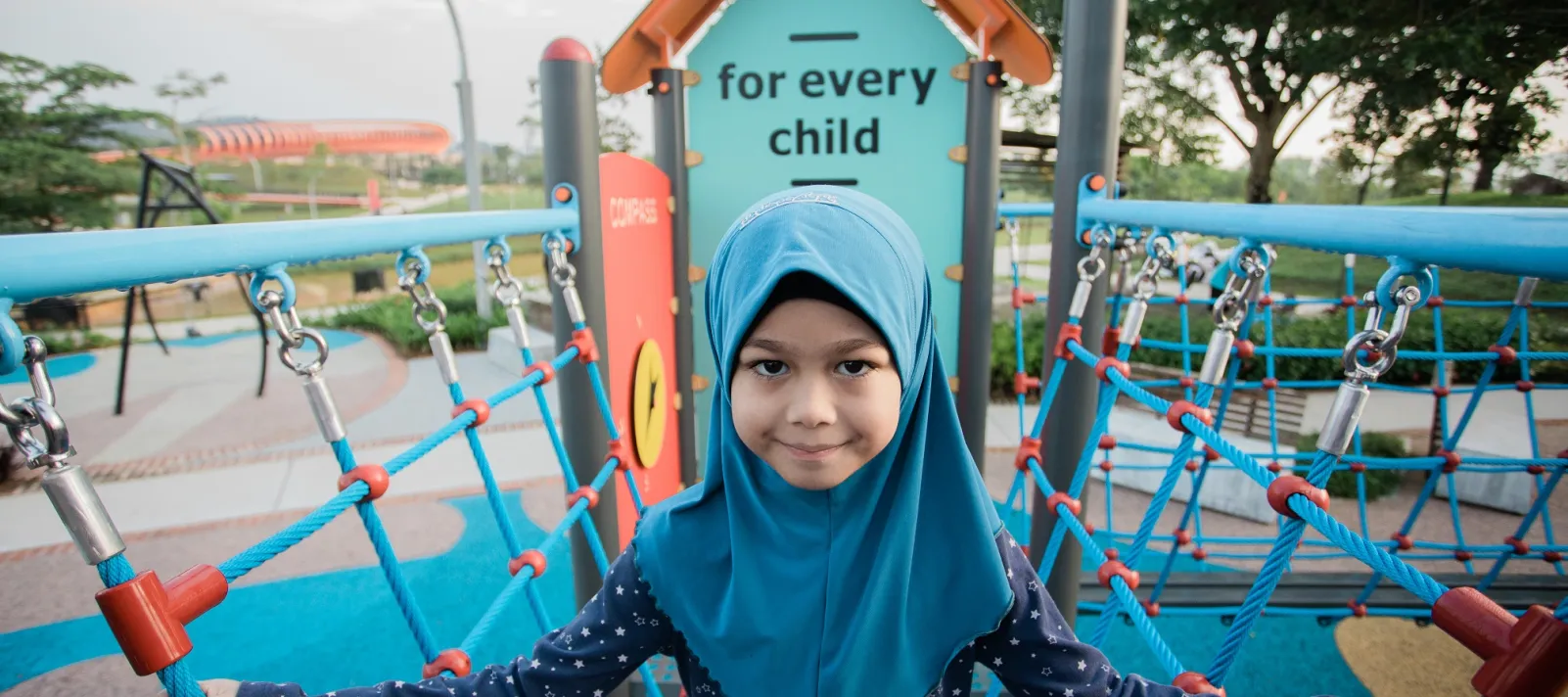 Child on a playground bridge