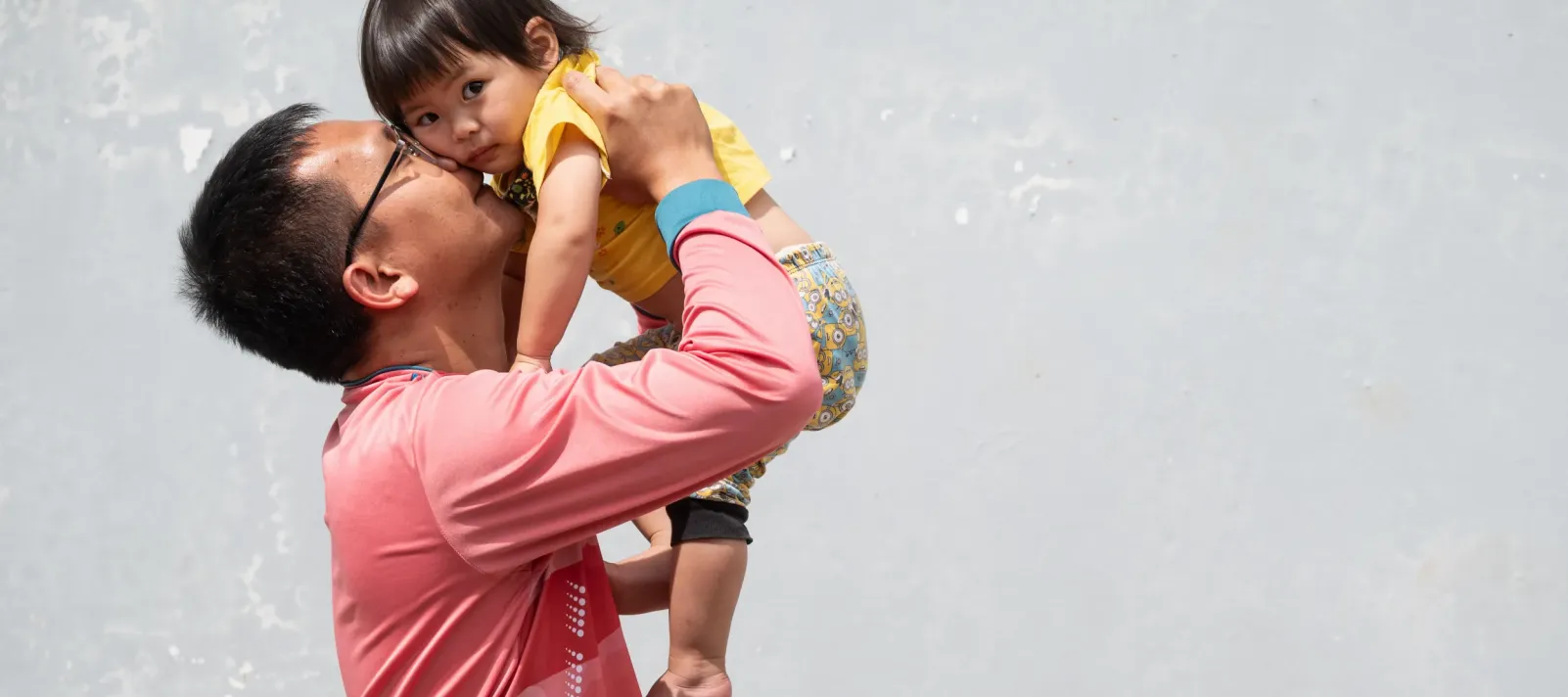 Father holding up his child
