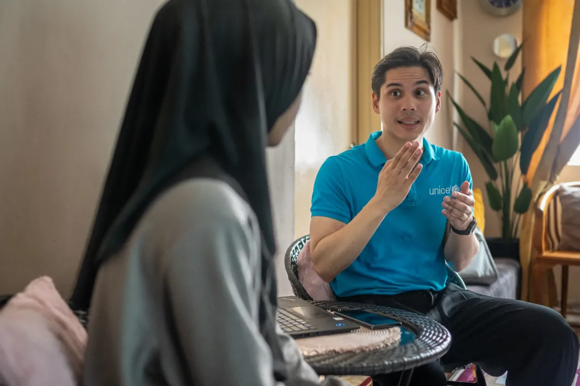 UNICEF Social Policy Specialist, Muhammad Farqani Mohd Noor visits Ima and Aaira at their home. By listening closely to families, ASUH KL  combines cash assistance with nutrition-focused guidance that reflects real needs and daily realities. 