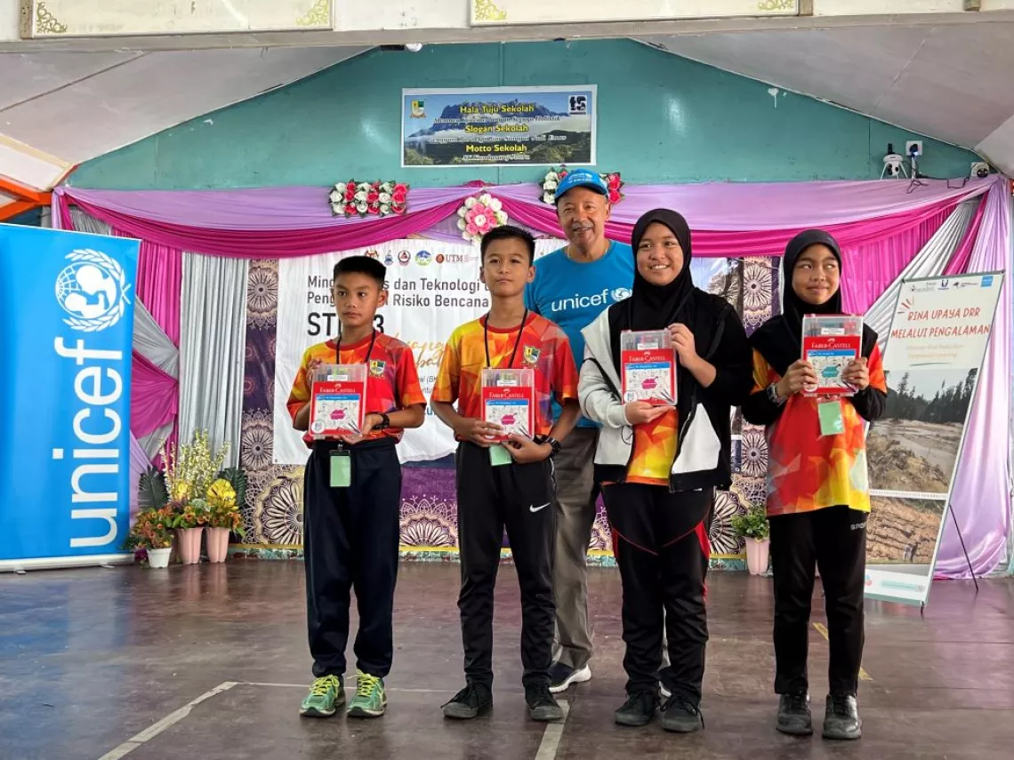 Students who won groupwork contest showing their gifts