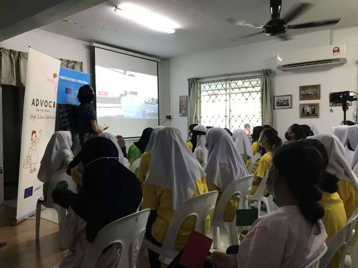 Students watch a video on human trafficking and exploitation 