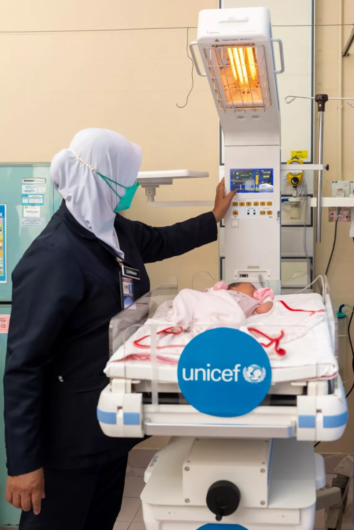Medical professional checks one of the donated equipment