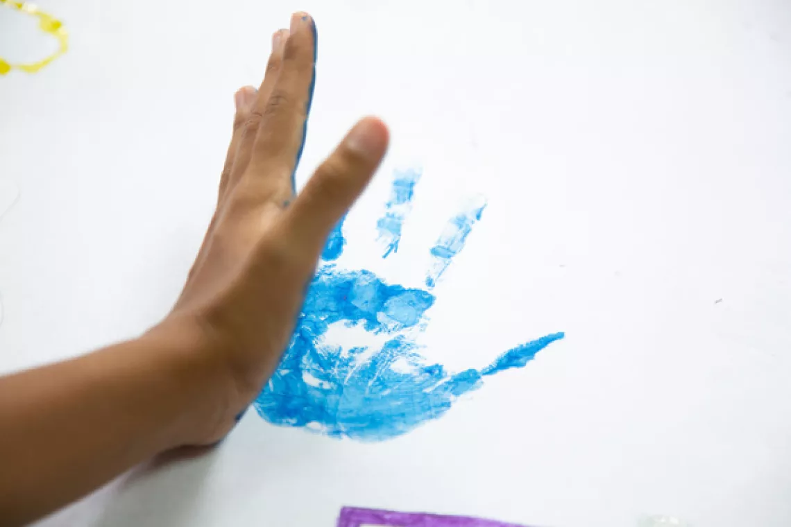 child's painted hand print