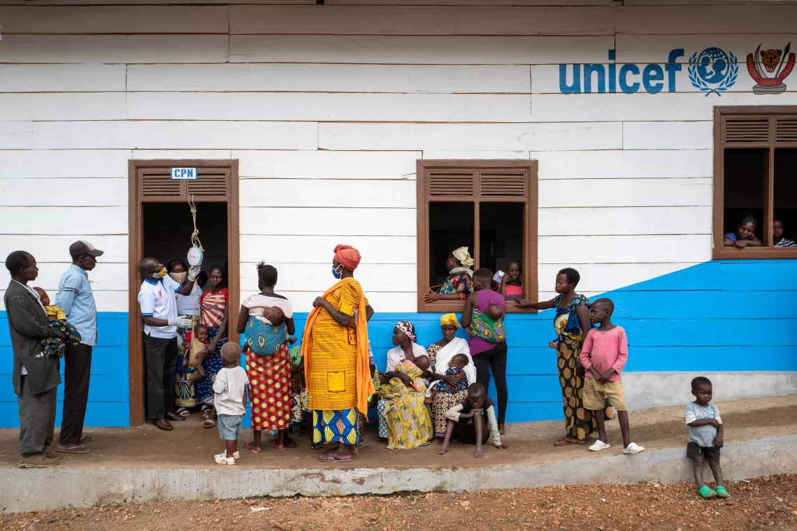 Democratic Republic of the Congo. Families line up outside a health centre.