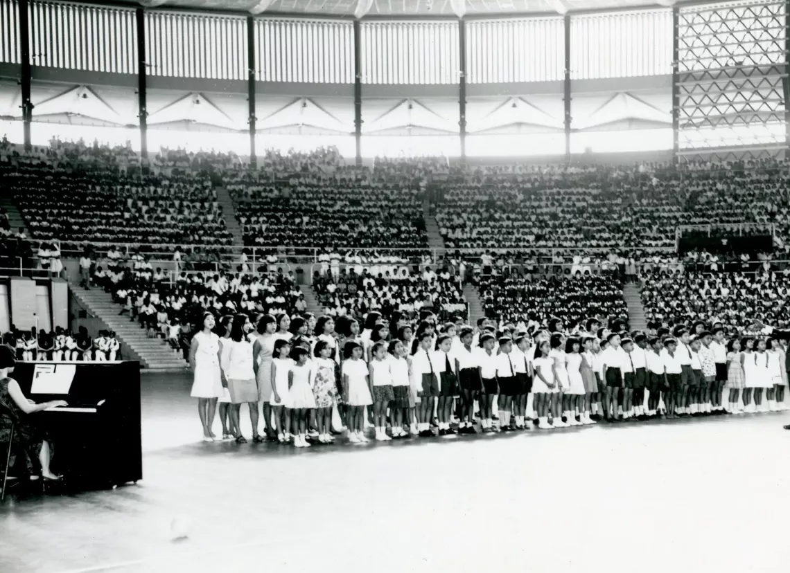 Assembly of children performing in stadium