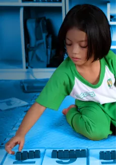 A child learning with blocks.