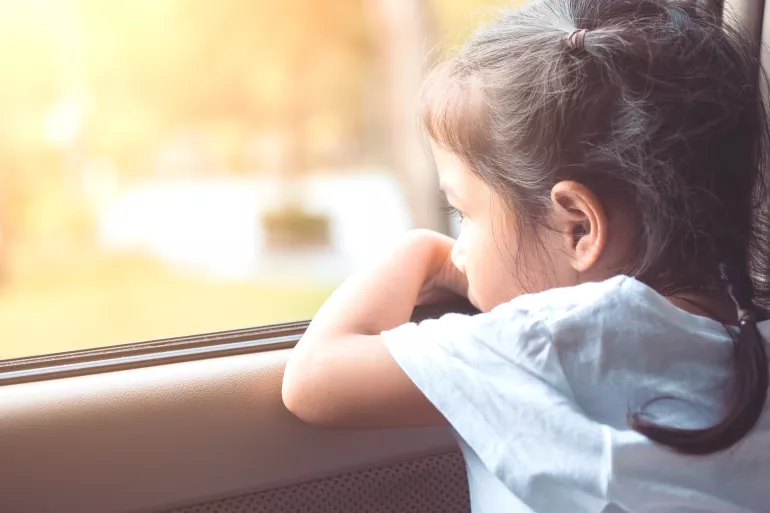 girl looking out window