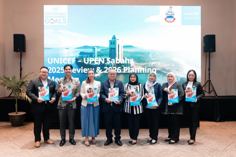 UNICEF Malaysia and UPEN Sabah representatives hold copies of the Sabah Child Wellbeing Index report during its launch in Kota Kinabalu. The report provides a comprehensive picture of children&rsquo;s wellbeing across Sabah and aims to support evidence-based planning and investment for children.