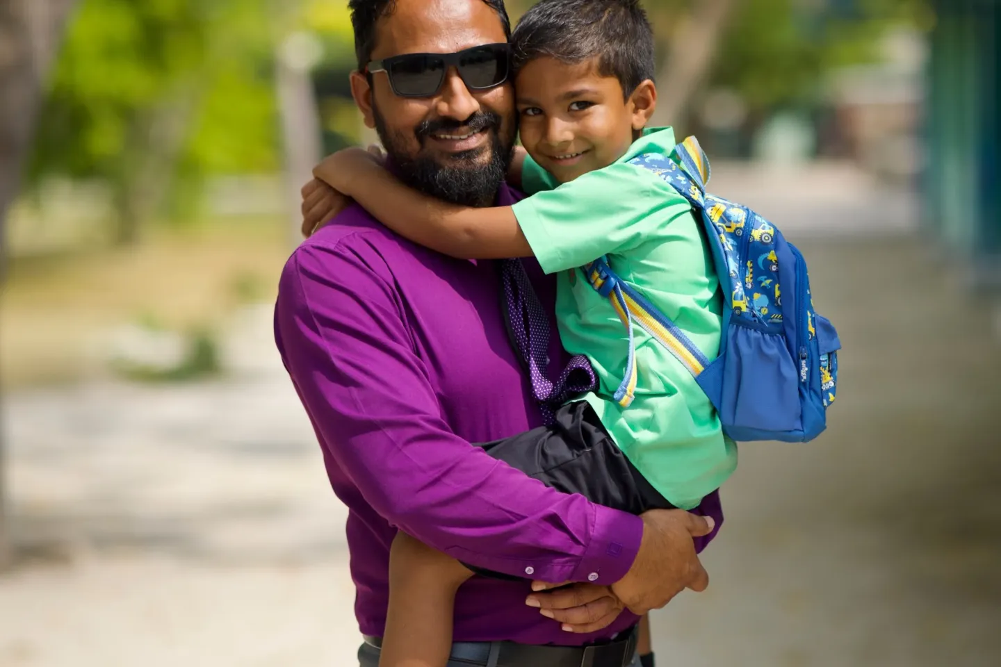 A father and child looking at the camera 