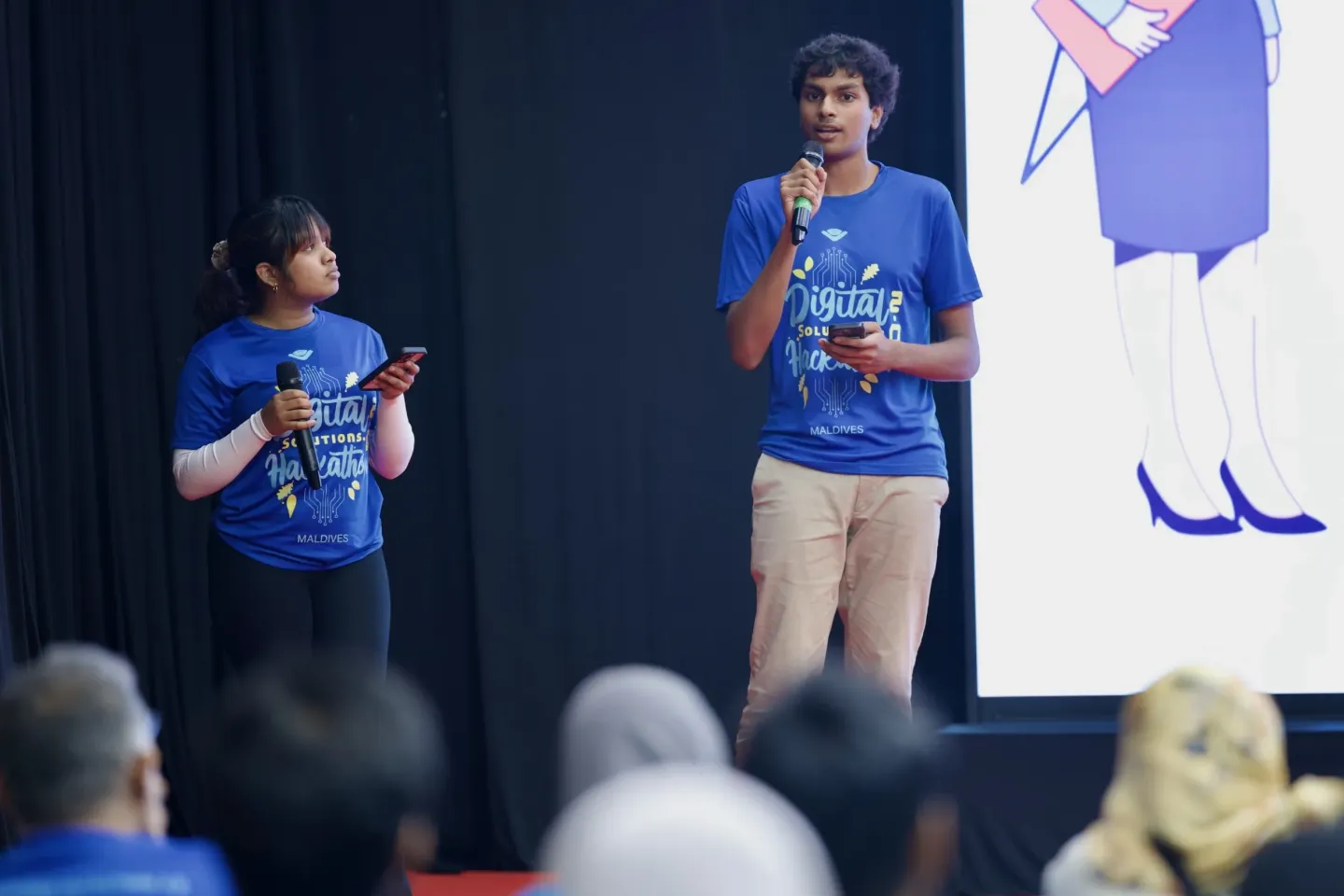 Two young people presenting their project at a Hackathon held to mark World Youth Skills Day 2025 