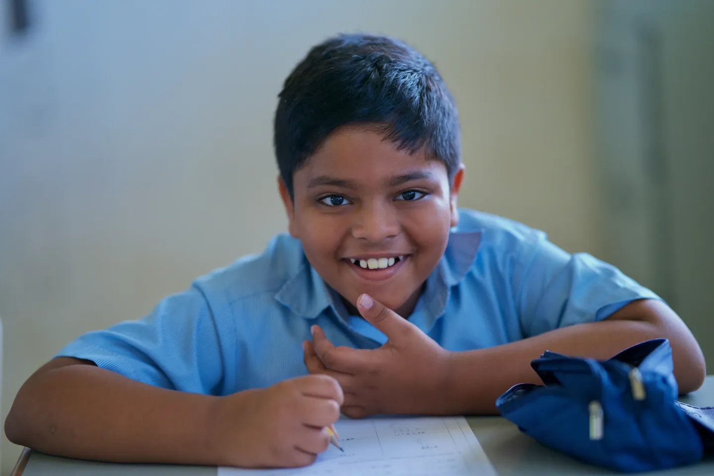 A student looking at the camera