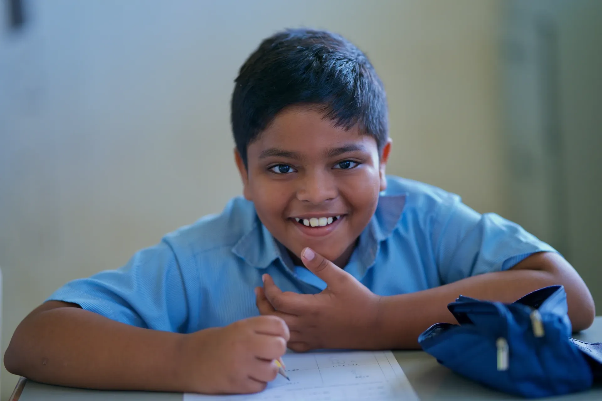 A student looking at the camera