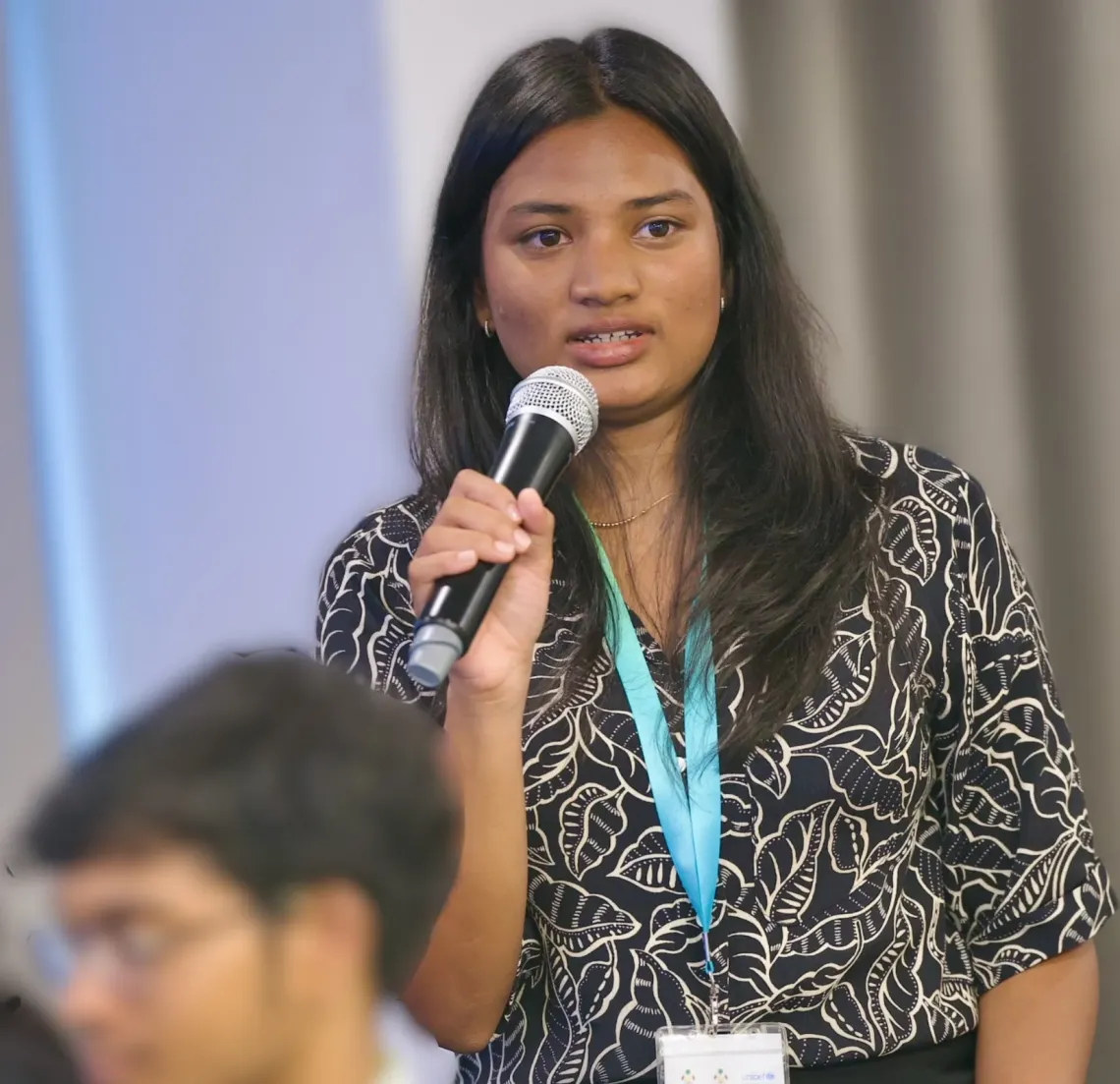 Yania speaking at Youth Track to COP30 