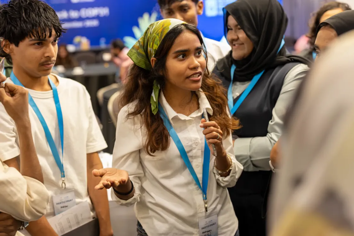 Participant at Youth Track to COP31 at mock negotiations