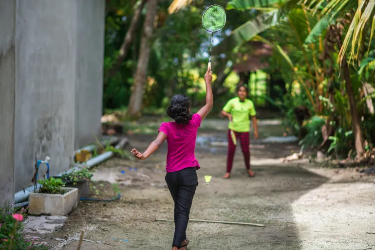 Girls playing badminton