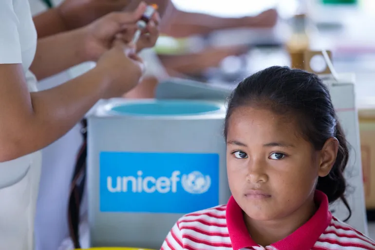 Girl from Samoa waiting for her vaccination