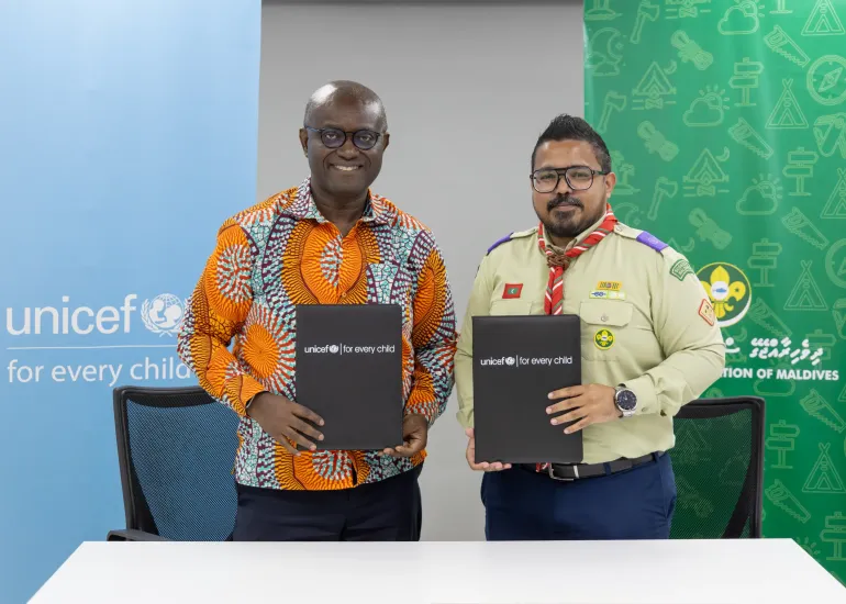 UNICEF Representative to Maldives, Dr. Edward Addai and the Chief Commissioner of the Scout Association of Maldives, Ismail Rifau at the signing ceremony