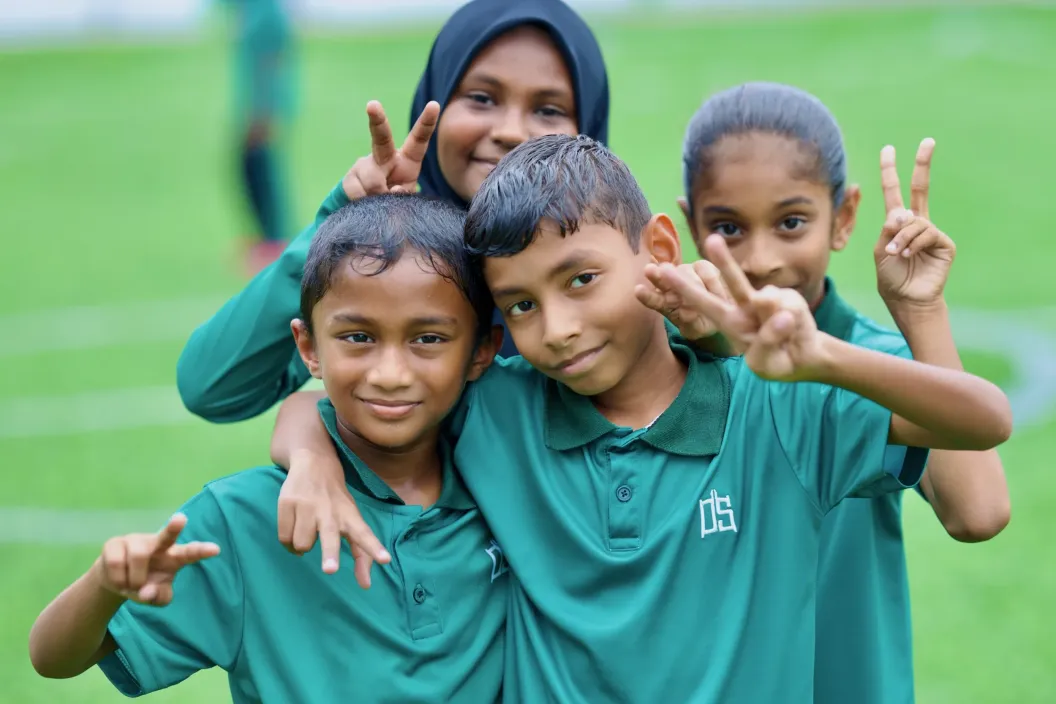 Students looking at a camera