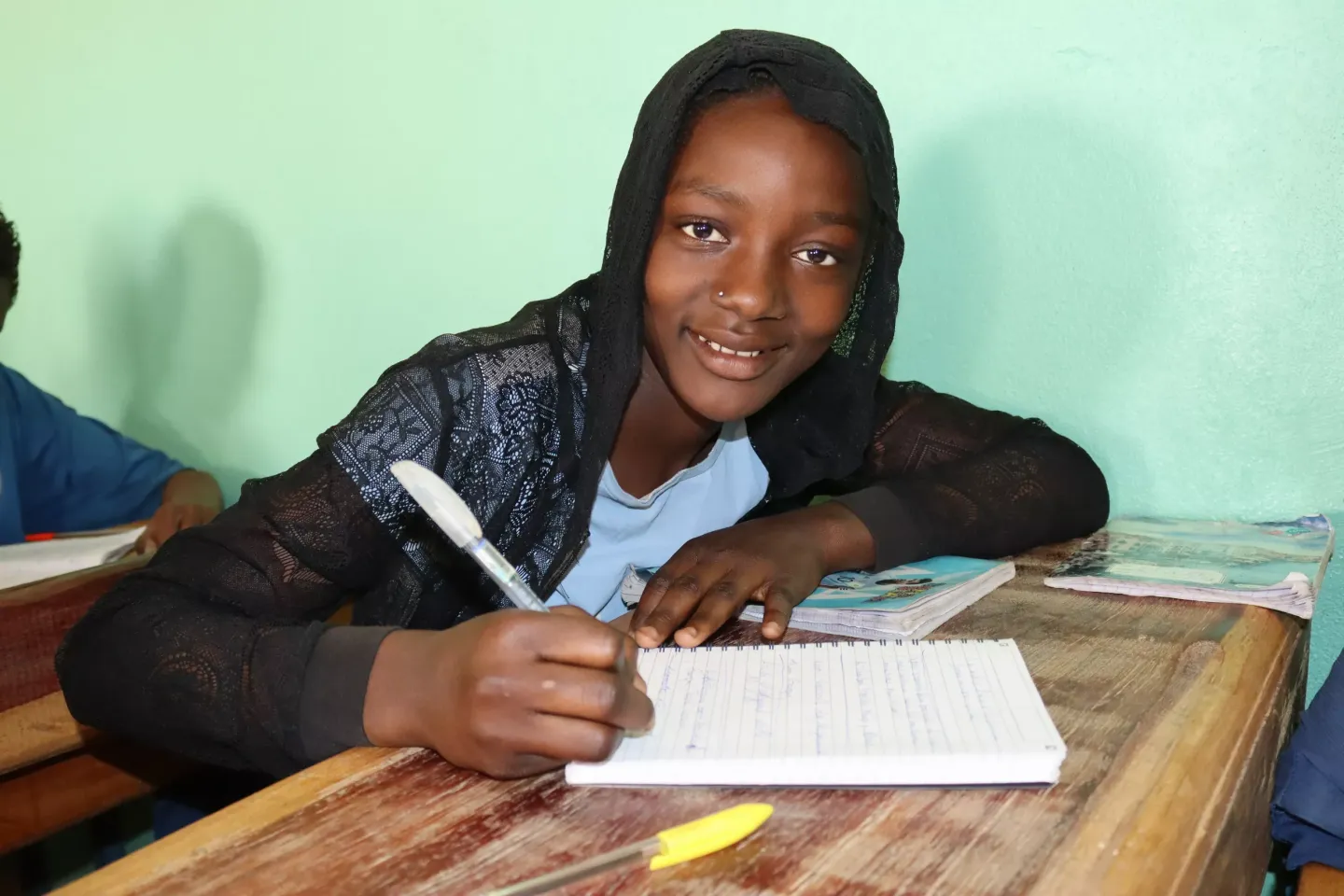 Aichatou, 12, a fifth-grade class at Kongo Gamo Basic School, studying grammar and conjugation.  