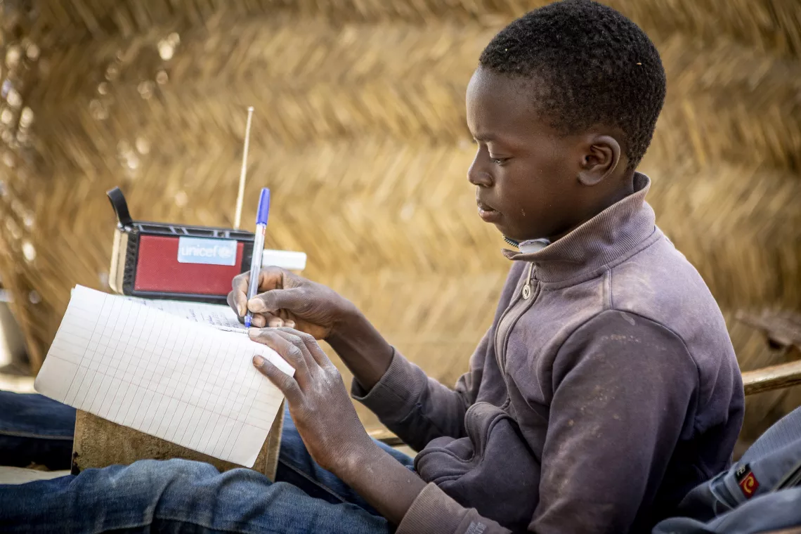 Makono Coulibaly, 13, in the 6th grade at the Adama Dagnon school, here at home. &ldquo;Every Wednesday and Thursday evening, as I don't have classes, I listen lessons on the radio. It&rsquo;s helpful for me and now I am proud because I get quite good marks&rdquo;. His parents left the southern region of Koulikoro after armed attacks forced the family to seek refuge in the region of Segou, which is completely central and more than 200 km from Segou. UNICEF supported 51,747 school-age children to access education through Temp