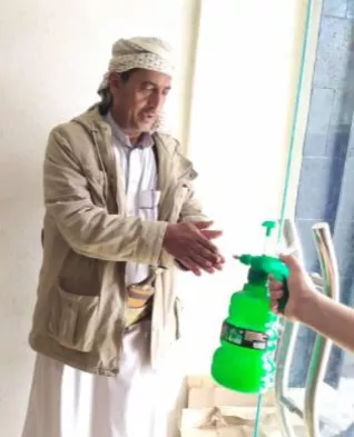 a man sanitizing his hands