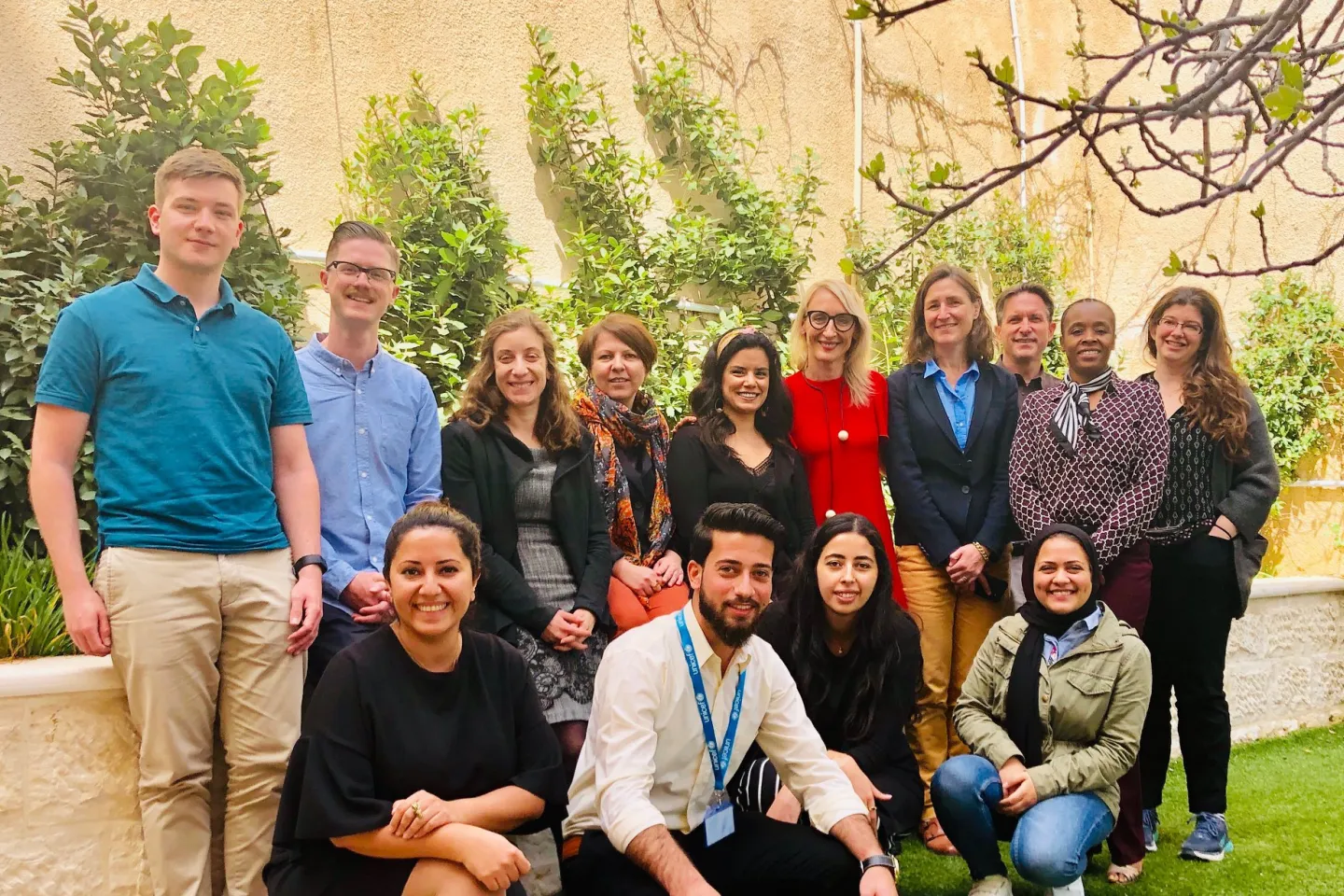 Group photo of steering member committee and youth 